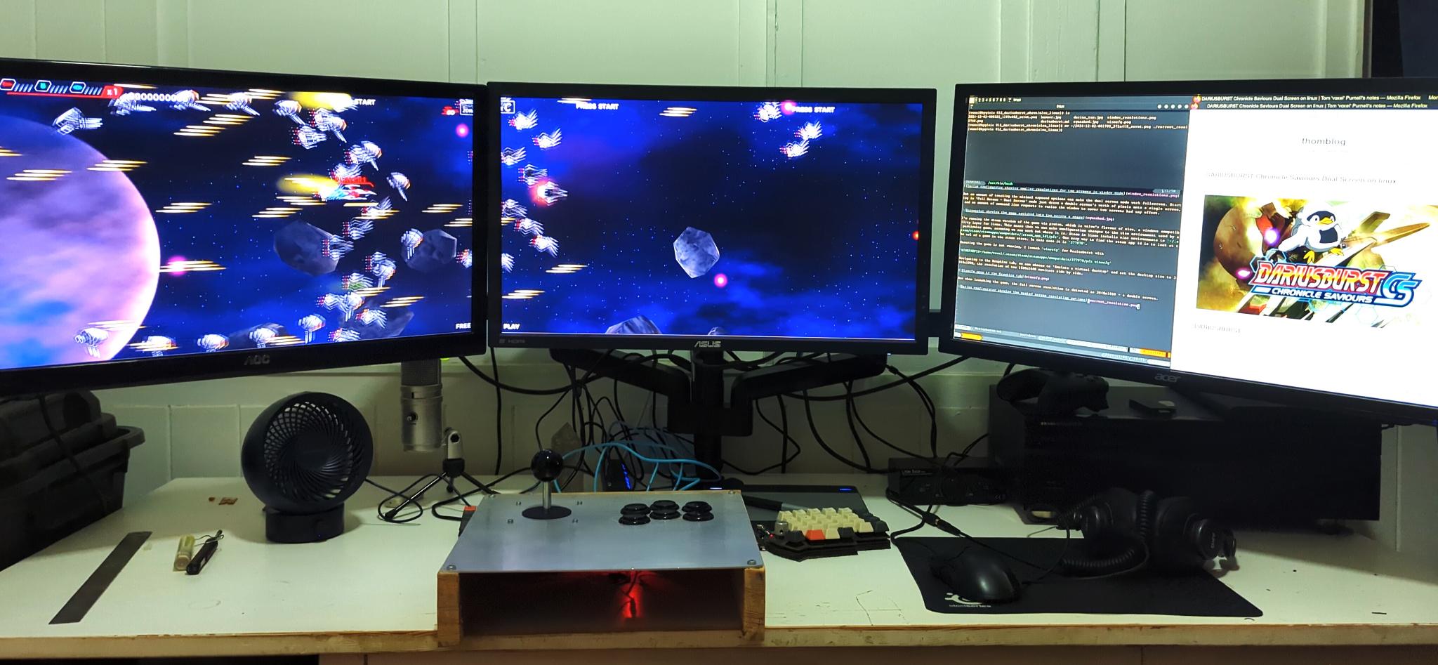 A photo of my workdesk playing the game across two monitors